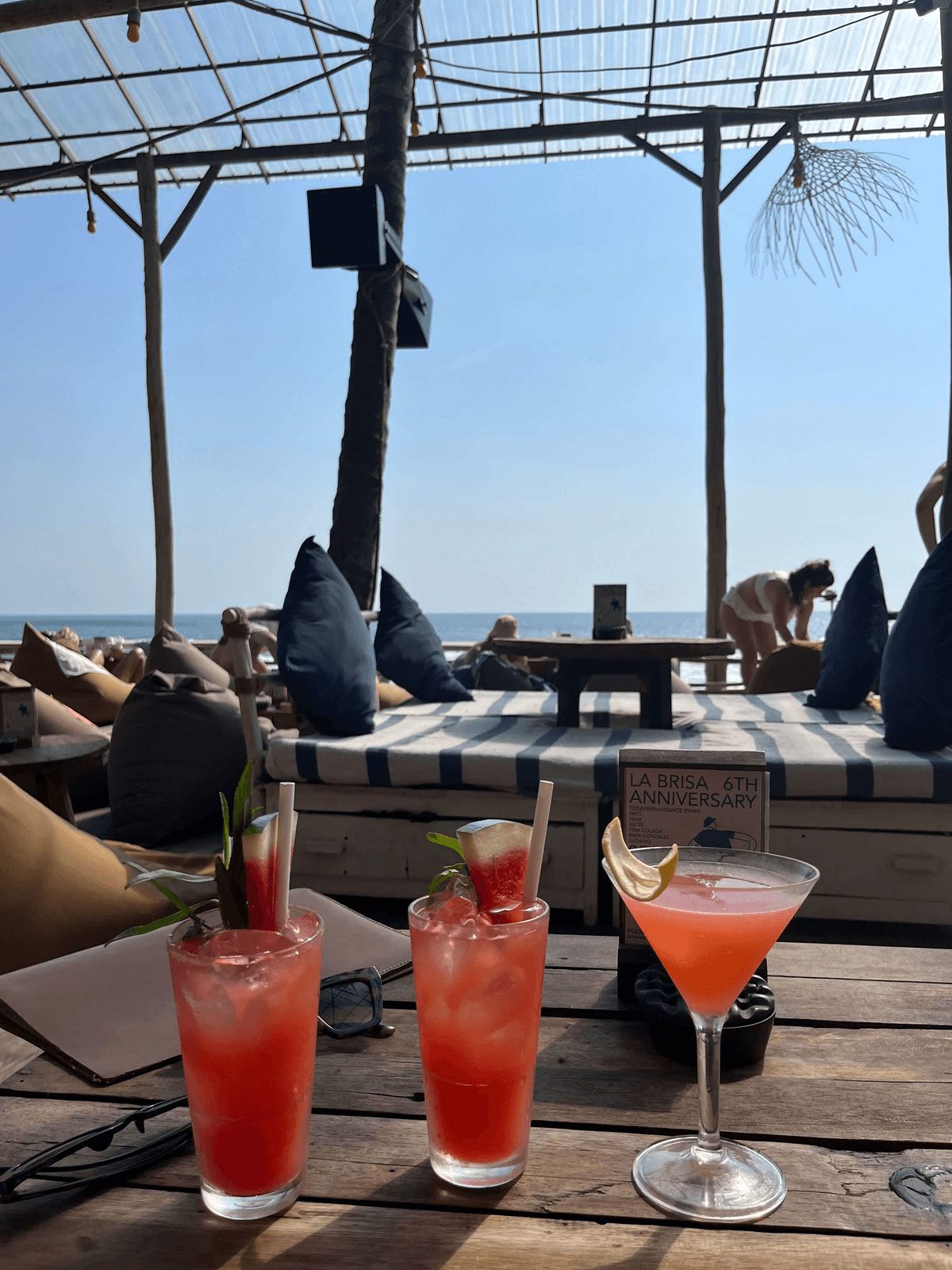 image of cocktails and a beach on the background